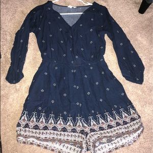 A navy blue romper with colorful accents!